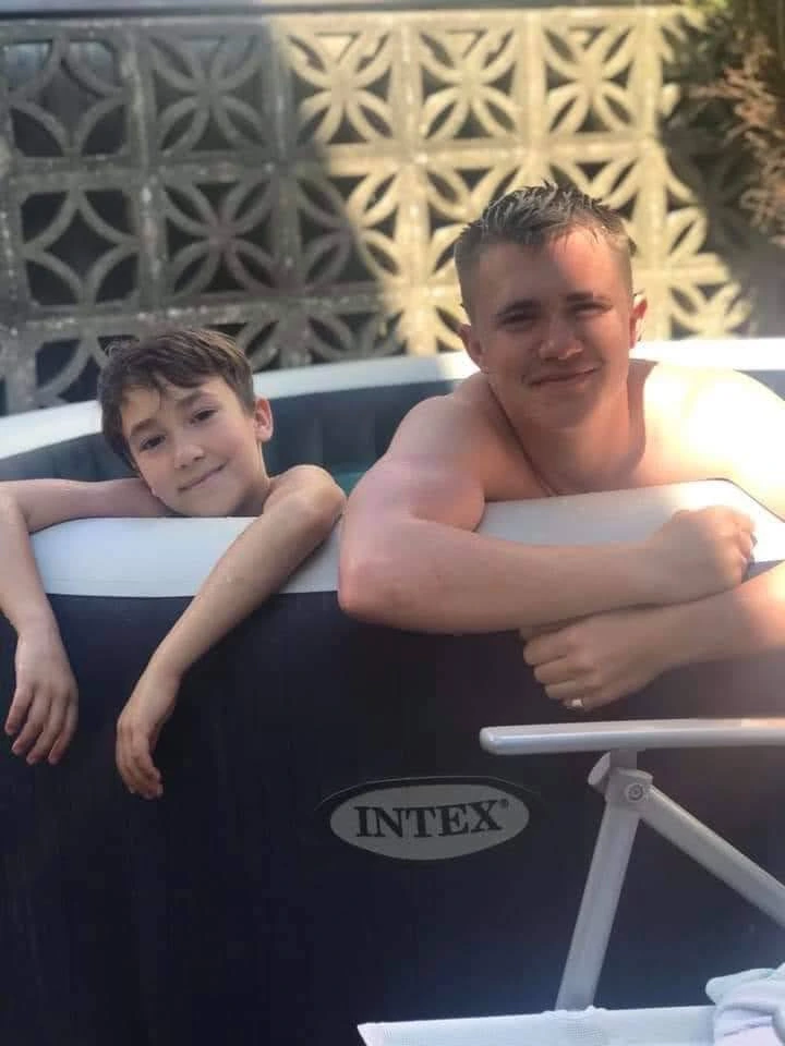 two brothers in a hot tub